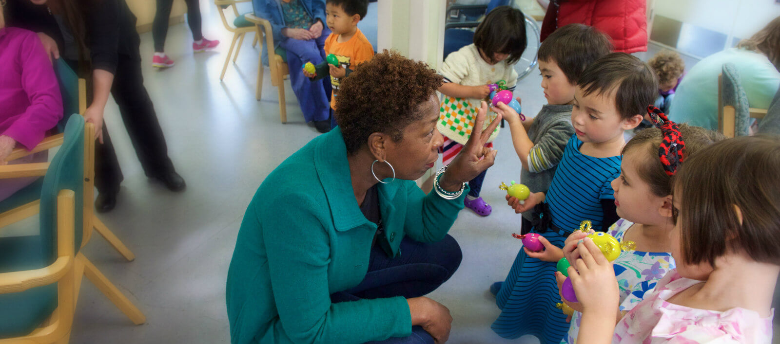 Micheal Pope playing with children at ASEB